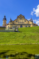 Fototapeta na wymiar Travel Concepts and Tourist Destinations. Renowned Nesvizh Castle on The Hill as a Profound Example of Medieval Ages Heritage and Residence of the Radziwill Family