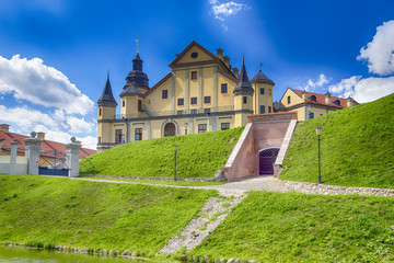 Fototapeta na wymiar Travel Concepts and Tourist Destinations. Renowned Nesvizh Castle on The Hill as a Profound Example of Medieval Ages Heritage and Residence of the Radziwill Family.