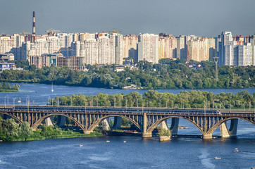 Railway bridge over Dnipro and view of the residential area of Kiev