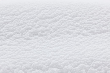 Snow in car window closeup texture background