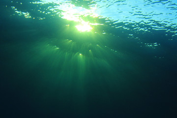 Underwater blue background and sunlight
