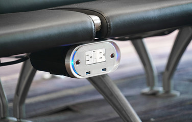 Close up on charger outlet under seat in the airport