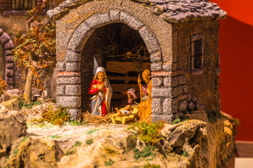 Christmas creche with Saint Joseph and Blessed Virgin Mary - obrazy, fototapety, plakaty