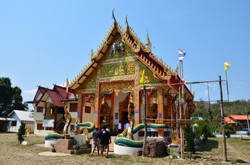 Travlers thai people go to Wat Don Moon temple for praying and respect Buddha statue inside Ubosot