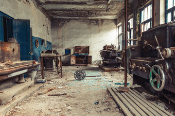 Fototapeta na wymiar Old abandoned factory rooms, lathes