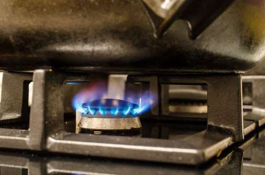 Iron pot on burning stove