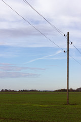 Fototapeta na wymiar telegraph pole in autumn landscape