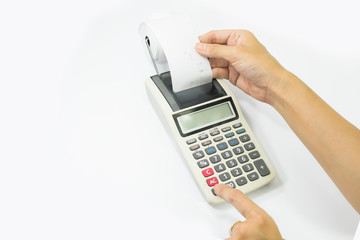 Left hand presses the keys of the printing calculator, the right hand takes out a paper check