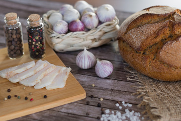 Homemade salted pork lard with bread, garlic and pepper according to Ukrainian traditions