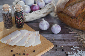 Fototapeta na wymiar Homemade salted pork lard with bread, garlic and pepper according to Ukrainian traditions