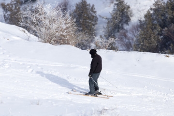 Man skiing in the snow in winter