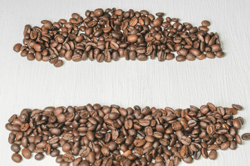 Frame of coffee beans with free space for text, white background top view