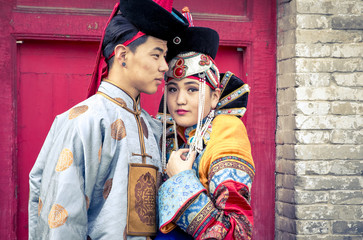 Fototapeta na wymiar mongolian couple in traditional 13th century style outfits 