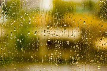 drops of rain on the window as a background