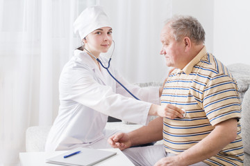 Fototapeta premium doctor with elderly men indoor