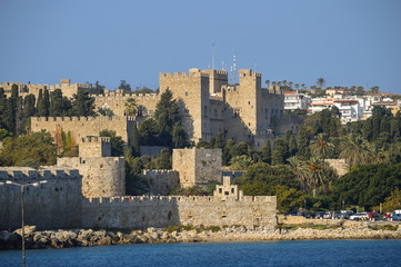 View of the medieval fortress of the city of Rhodes from the sea in Greece.