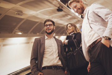 Business colleagues taking subway after work