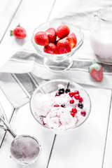 organic homemade ice cream in glass bowl on wooden background