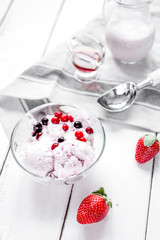 organic homemade ice cream in glass bowl on wooden background