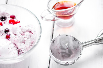 organic homemade ice cream in glass bowl on wooden background