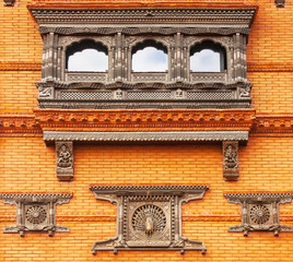 beautifull pattern on a red brick wall of a public Buddhist temple in China.