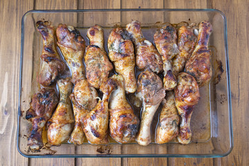 chicken legs on a transparent dish