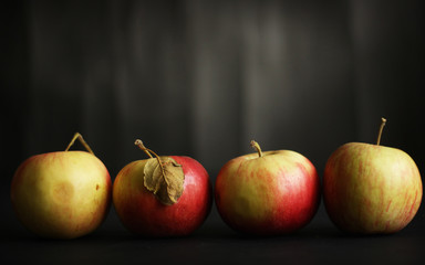 Four red apples