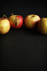 Four red apples