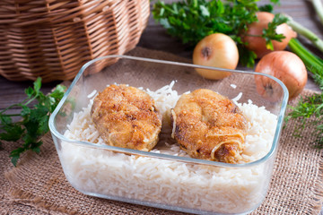 Healthy lunch container. Rice and fish