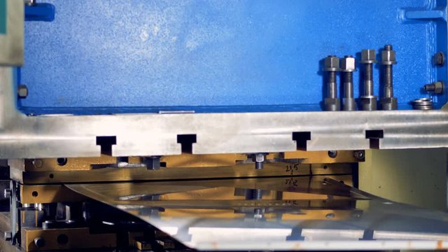 Industrial hydraulic press working.