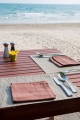 restaurant table with blurred beach background - Selective focus