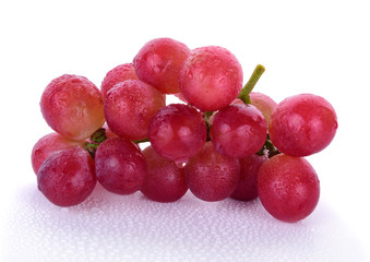 Red grapes and water drops isolated on white background