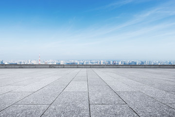 empty marble floor with modern cityscape