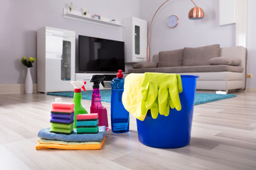 House Cleaning Products On Hardwood Floor