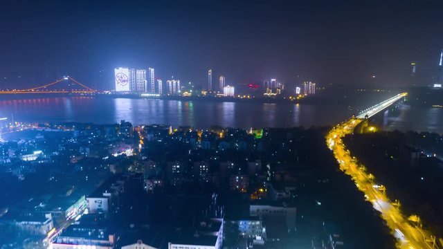 night time illuminated wuhan cityscape downtown bay aerial riverside panorama 4k china
