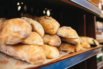 Delicious french pastry stands on the shopboard