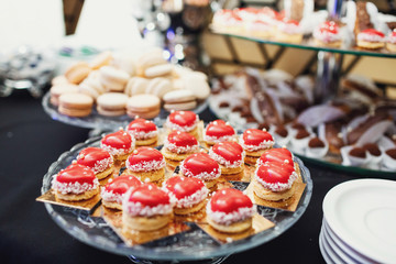 Cookies in form of hearts put on a glass plate