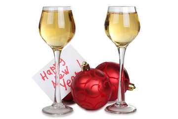 Christmas balls and wineglasses on white background