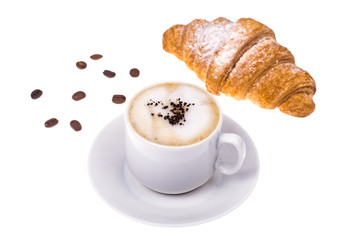 Fresh croissant and cappuccino on white background