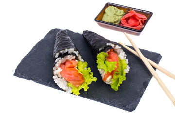 Tasty fresh sushi cone on black stone
