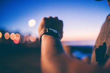 Man checking time on his smart watch