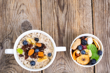 Oatmeal with fruit and nuts-hearty and tasty breakfast
