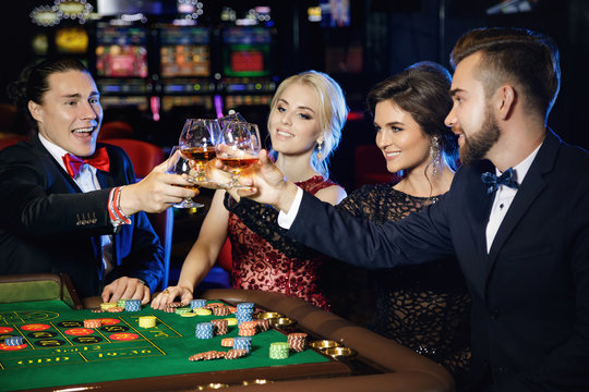 People celebrating their win after successful game in the casino