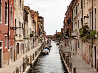 Fototapeta na wymiar Canals in Venice, Italy. You can walk all around or take a gondola a cross the city to find incredibles spots