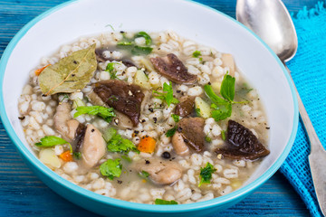 Soup with pearl barley, mushrooms