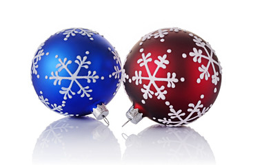 Close-up of beautiful blue and red christmas balls with snowflake pattern