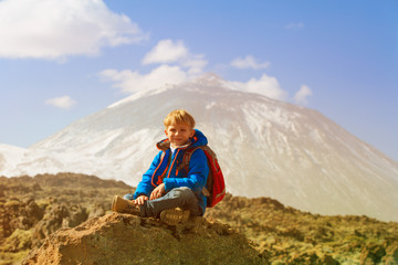 Fototapeta premium travel concept - little boy enjoy hiking in mountains