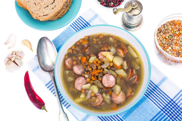 Dish from lentils, vegetables and sausages