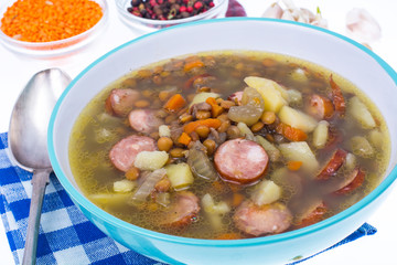 Dish from lentils, vegetables and sausages