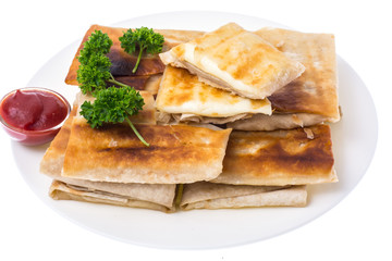 Grilled pita bread with cheese filling, close up,delicious and hearty breakfast